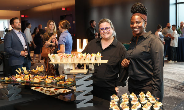 Legends Hospitality team serving hors d&rsquo;oeuvres at a Toledo event reception